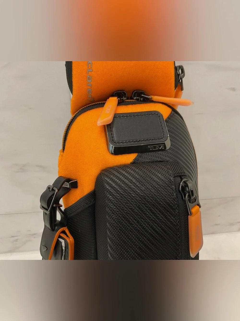 NEW Tumi McLaren Esports Downforce PRO Sling Crossbody - Black & Papaya Orange